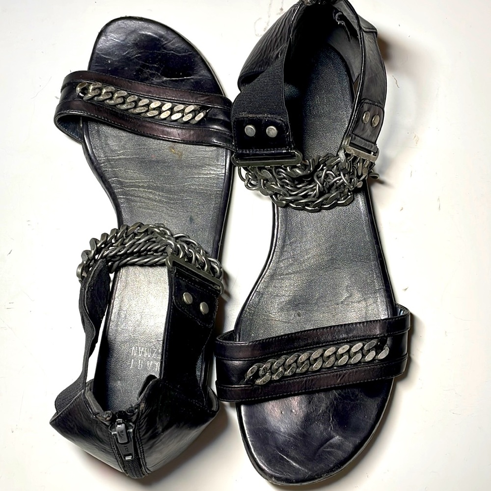 Stuart Weitzman black flat sandals with thick ankle chain detail